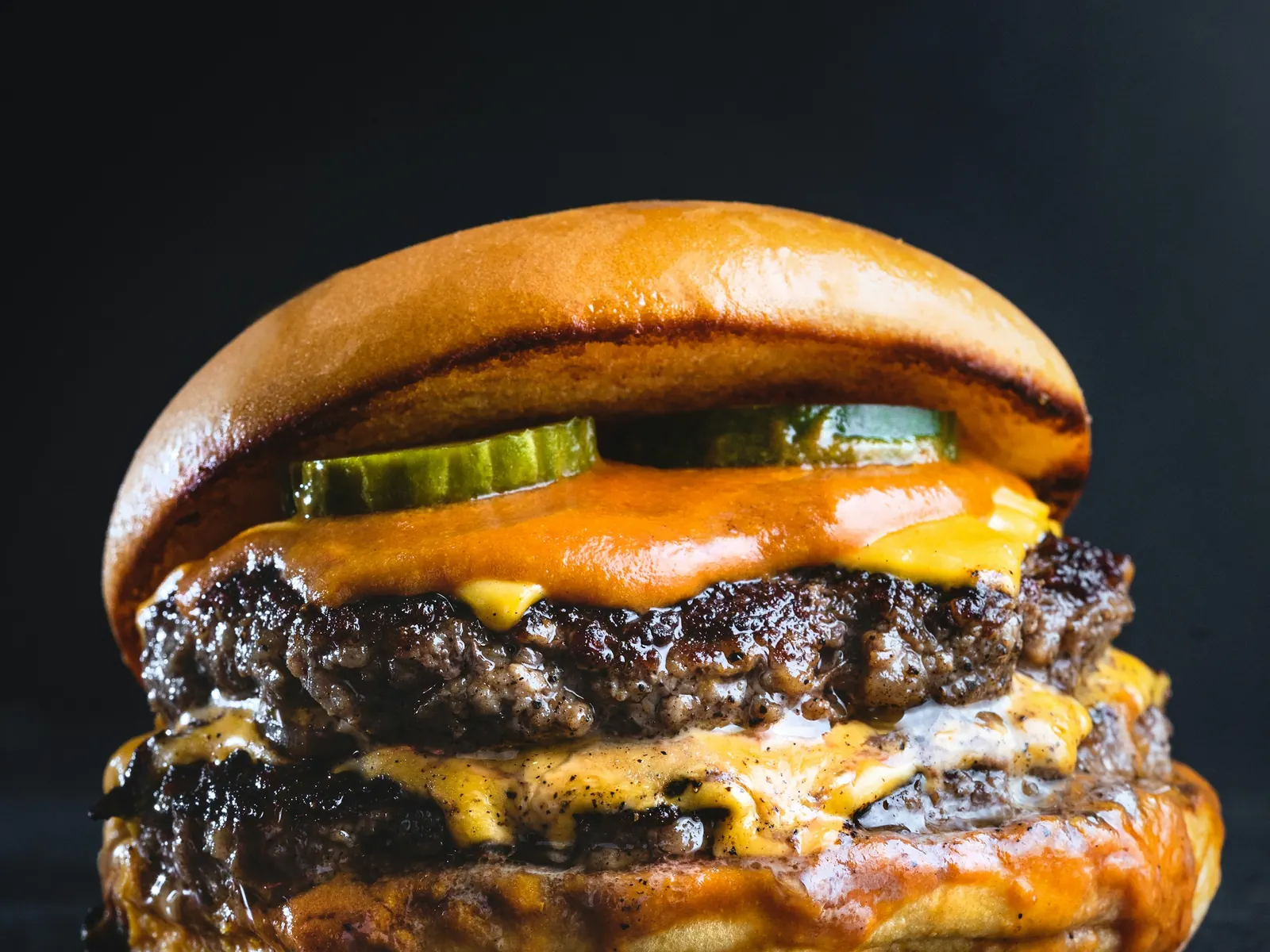 The Lace: a double smash burger with visibly craggy browned patty edges